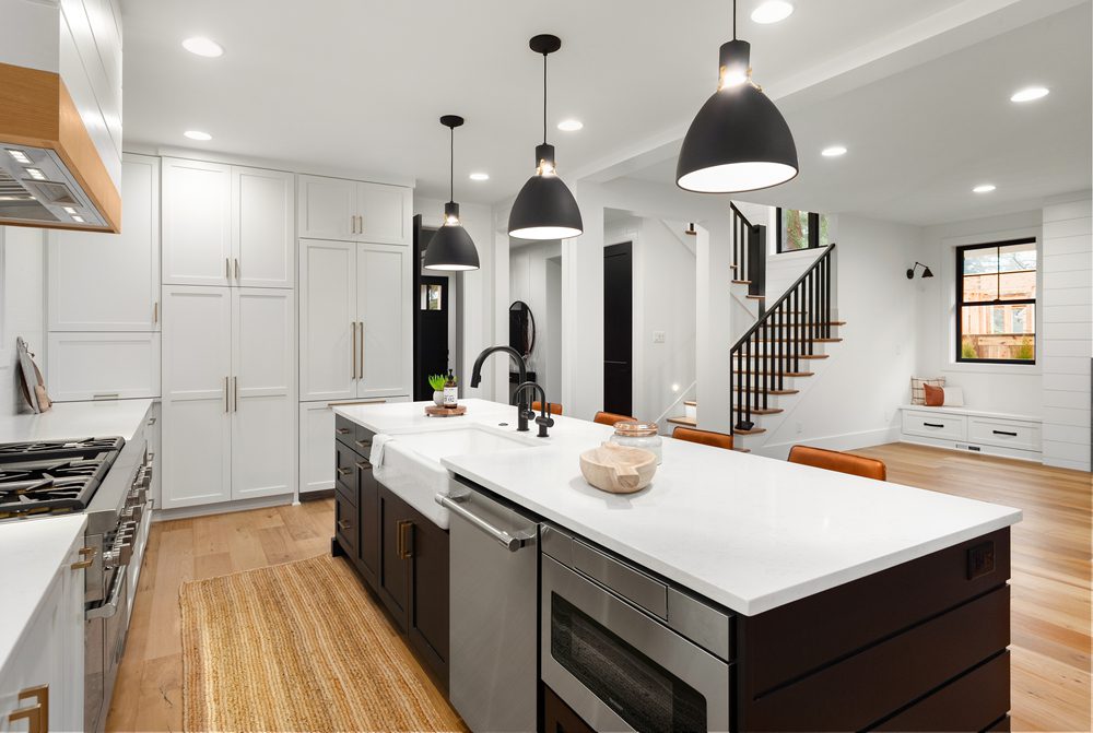 Modern Kitchen - Kitchen Island With White Countertop and Various Wooden Details