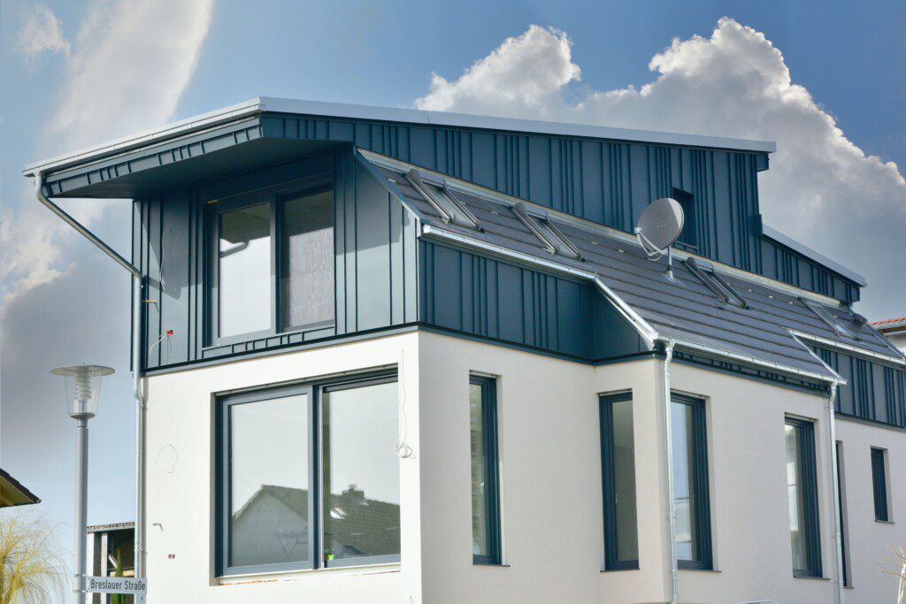 White and Blue Modern House With Predominant Windows - Outdoors Shot